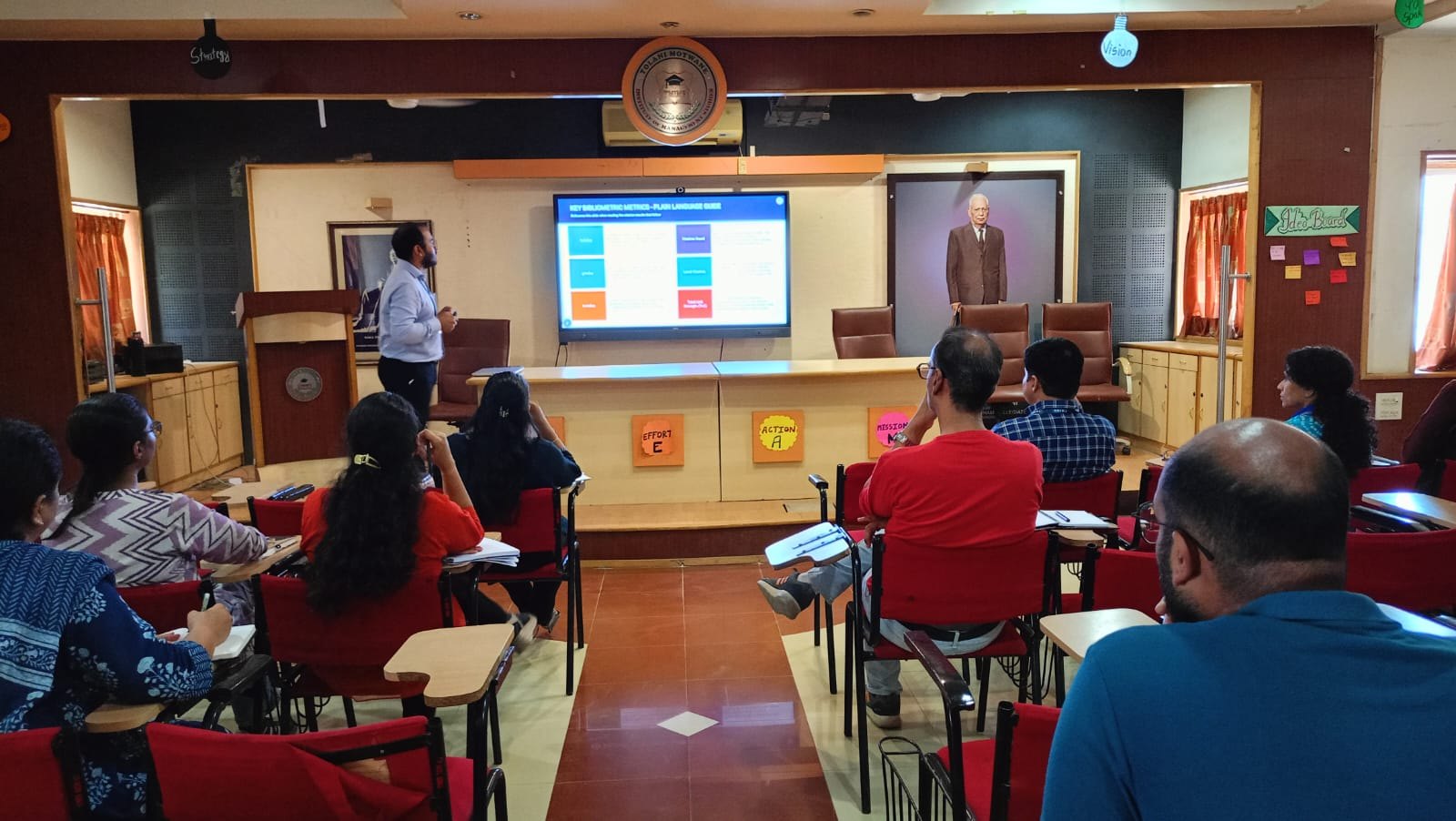 Faculty research seminar classroom discussion at TMIMS